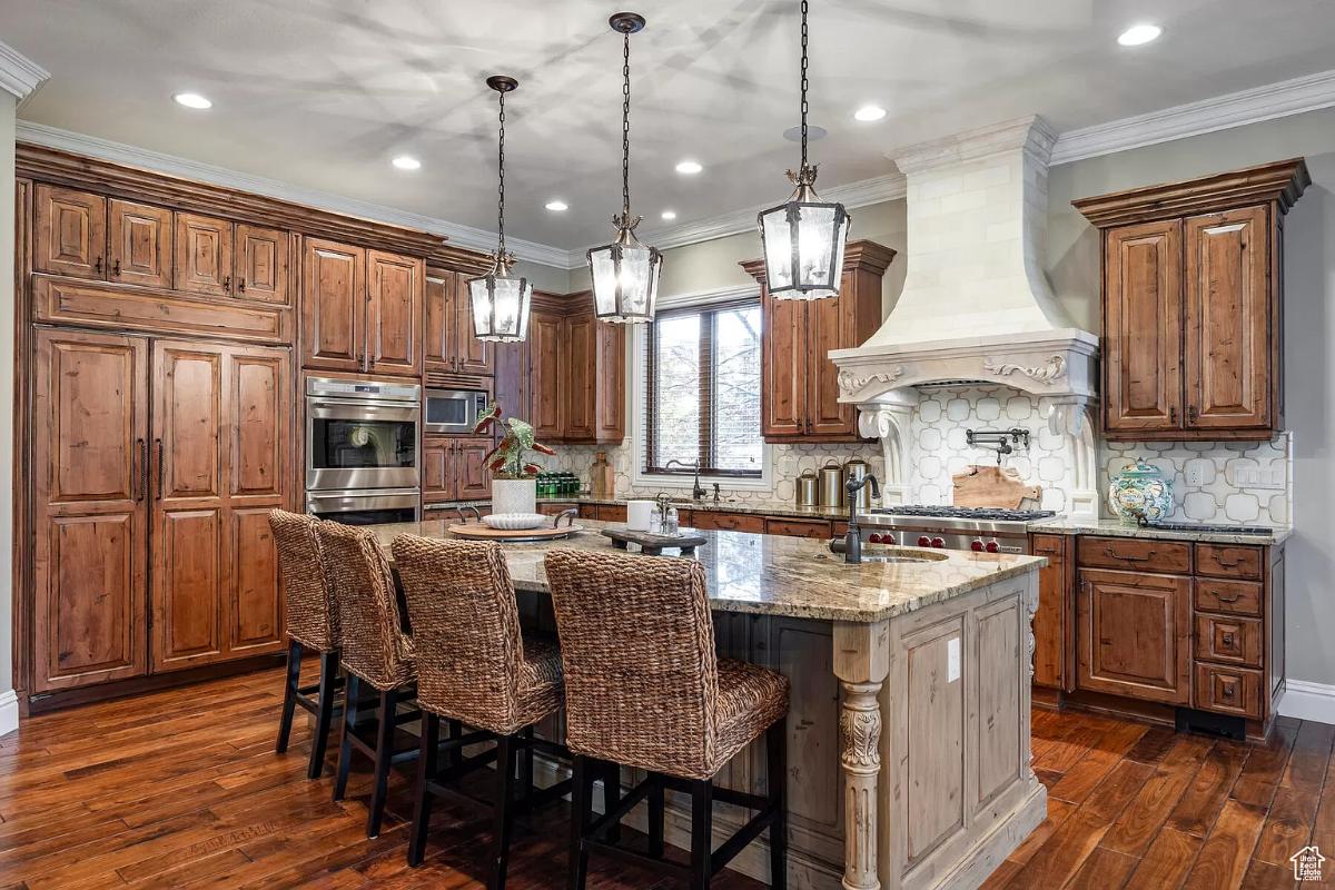 Kitchen with custom cabinetry and a center island prep area.