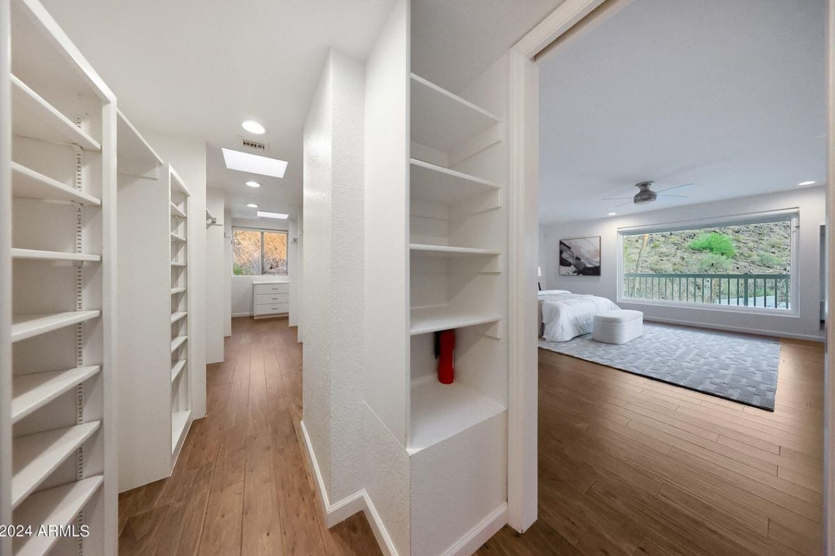 A walk-in closet with shelves.