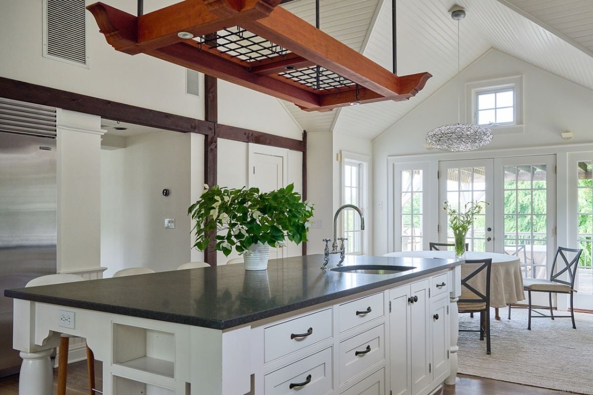 A kitchen with countertop, sink, and cabinets.