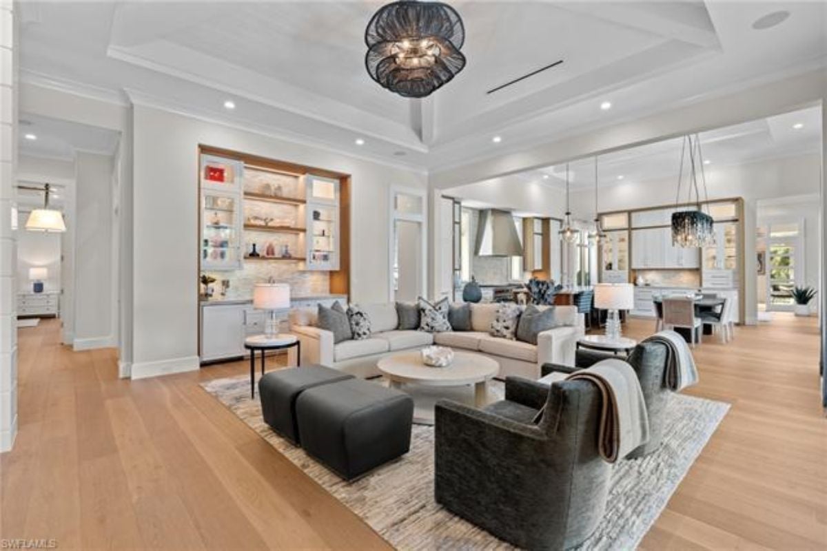 A great room with living space, a dining area, and a kitchen.