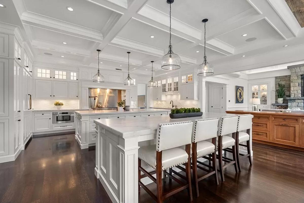 Kitchen with stainless-steel appliances, a counter breakfast bar and a center island prep area.