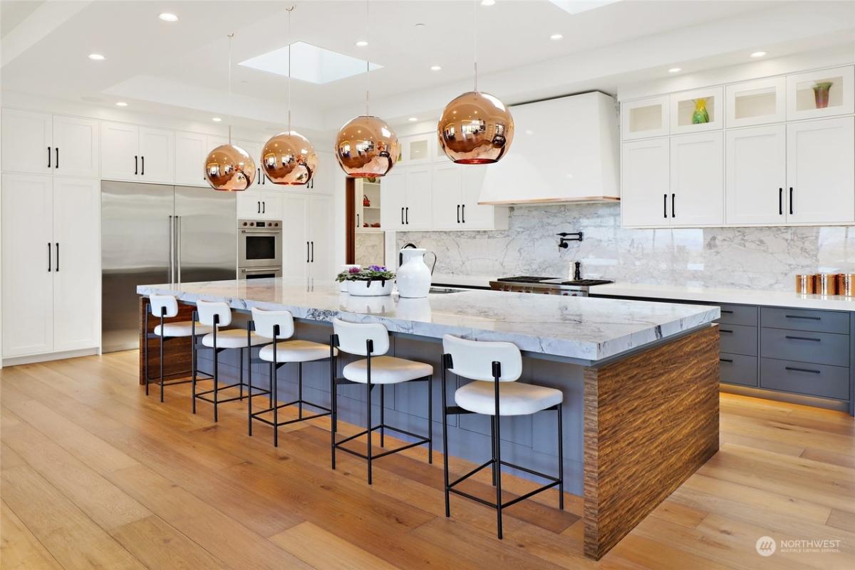 Kitchen with stainless-steel appliances and a counter breakfast bar.