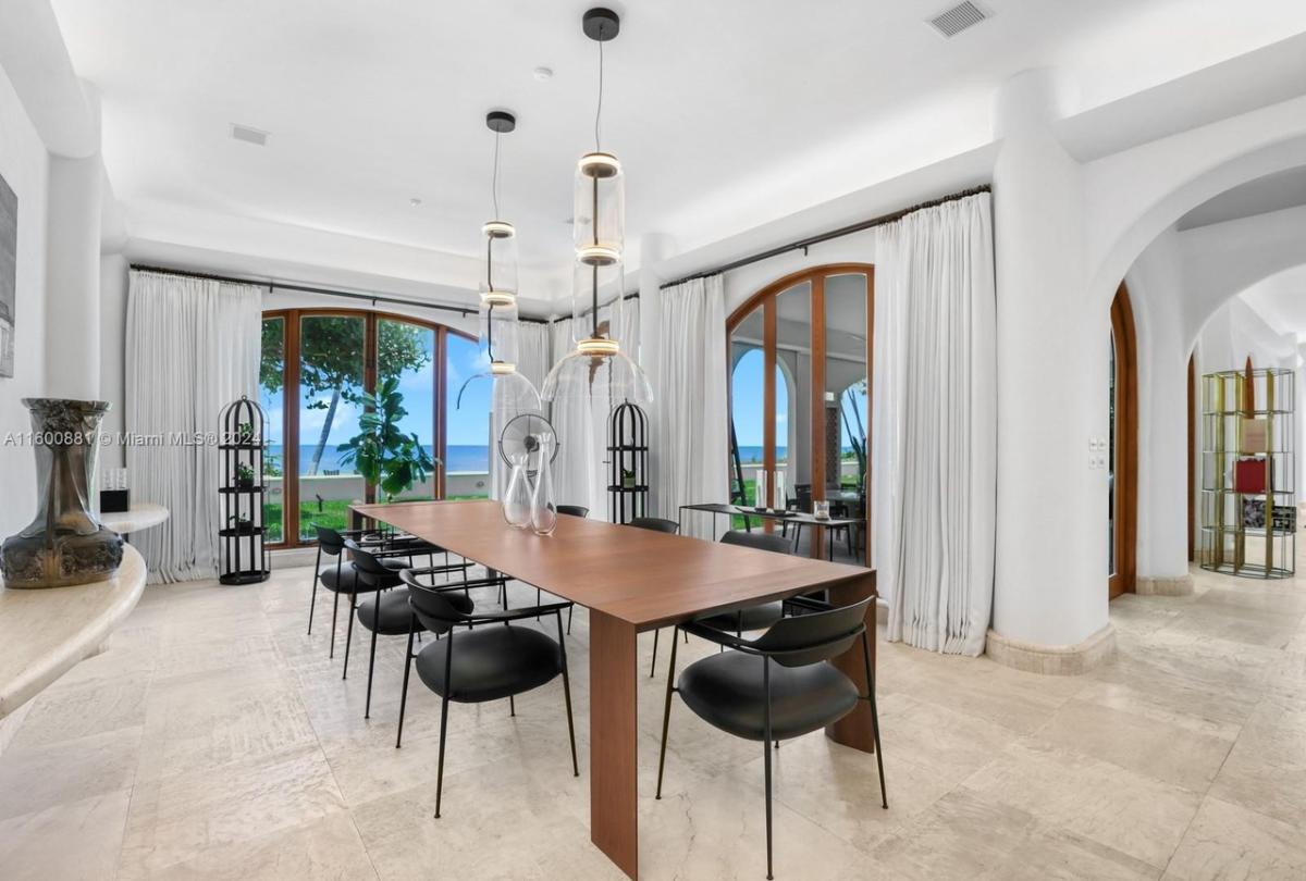 Dining room with a large table and chairs.
