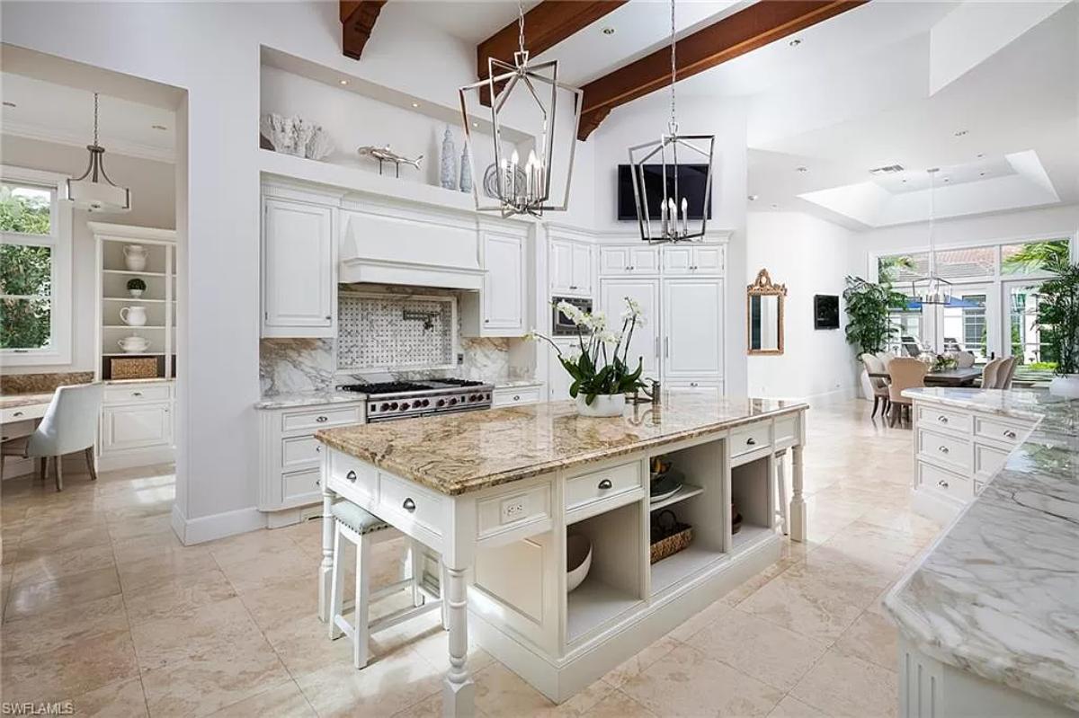 Kitchen with custom cabinetry and a center island prep area.