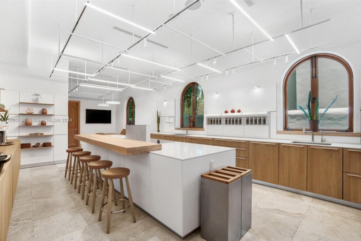 Kitchen with custom cabinetry and a counter breakfast bar.