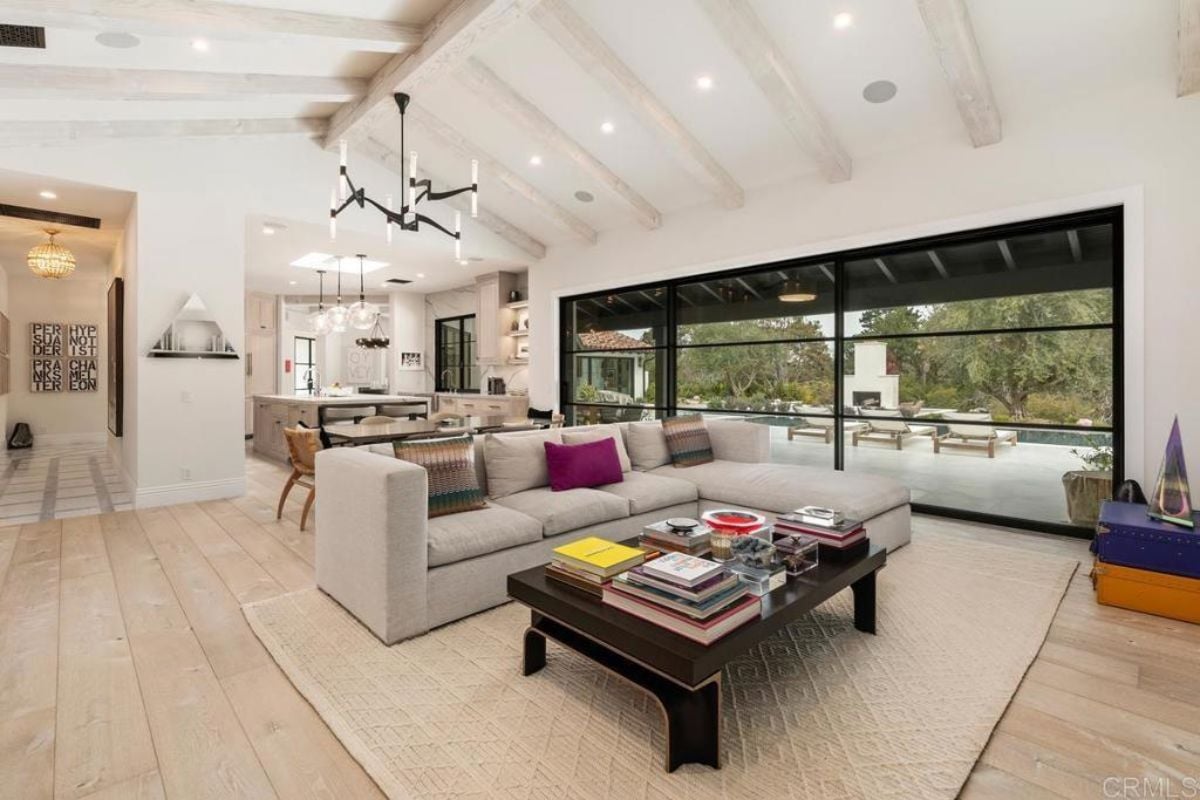 A great room with living space, dining area, and kitchen.
