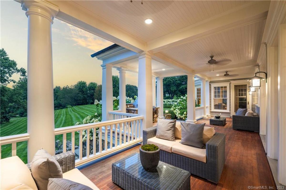 Balcony with tables and couches.