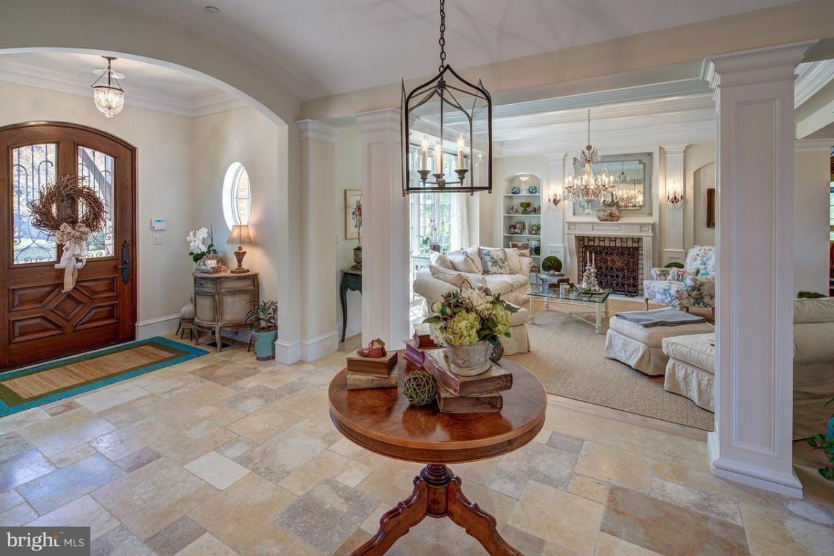 Foyer with a round wood table.