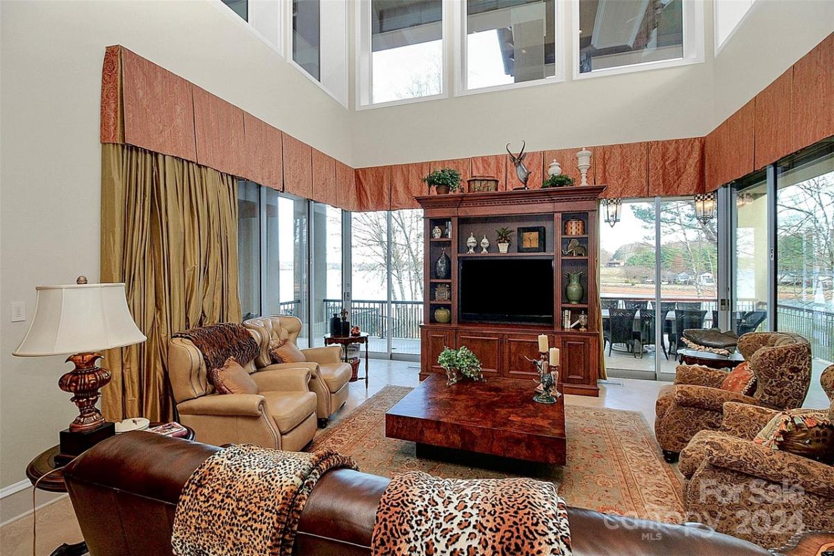Living room with a couches and sliding glass doors.