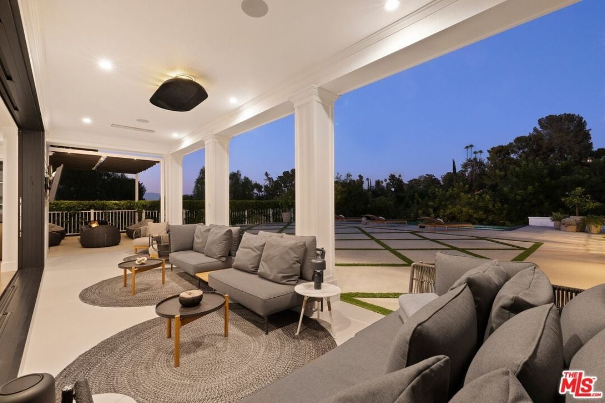 A porch with couches and a coffee table.
