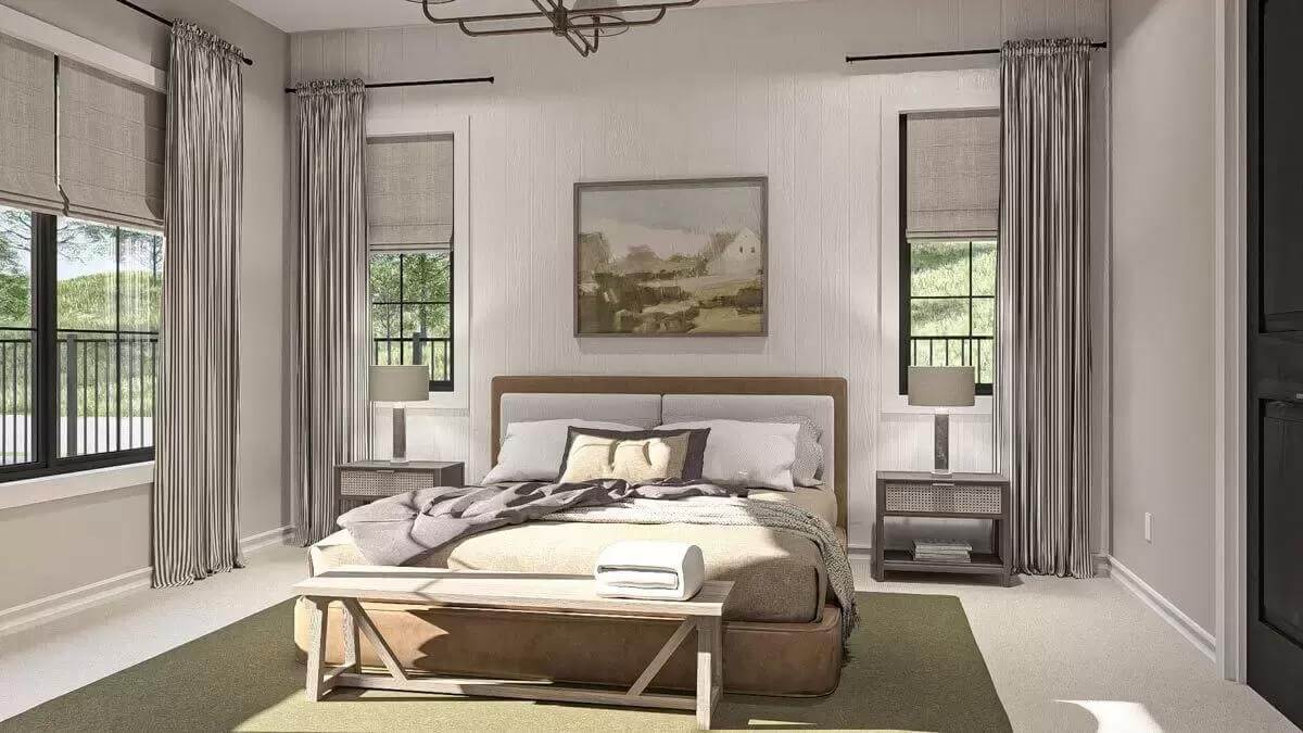 Primary bedroom with a platform bed and a rustic bench over the area rug.