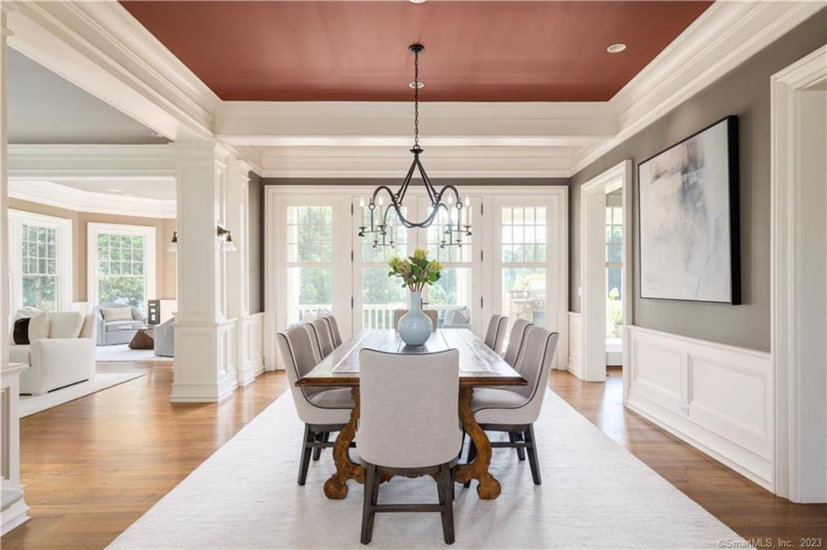 Dining room with a large wood table and chairs.