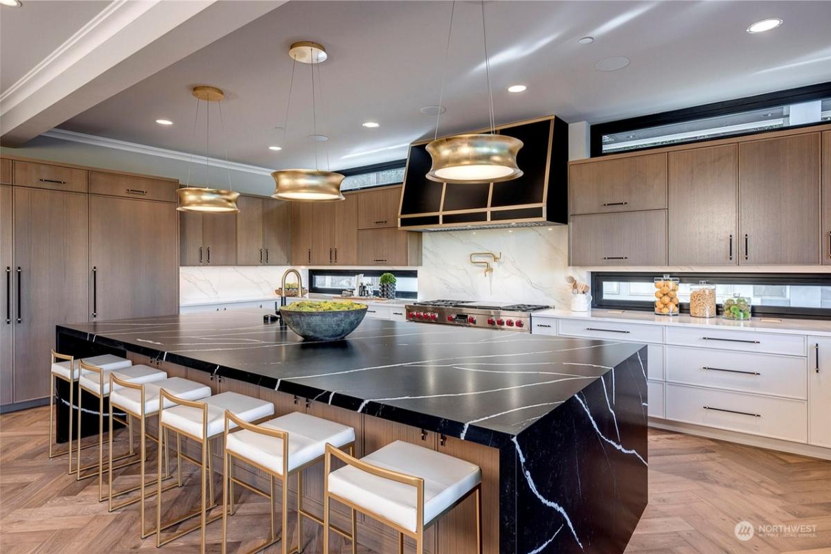Kitchen with custom cabinetry and counter breakfast bar.