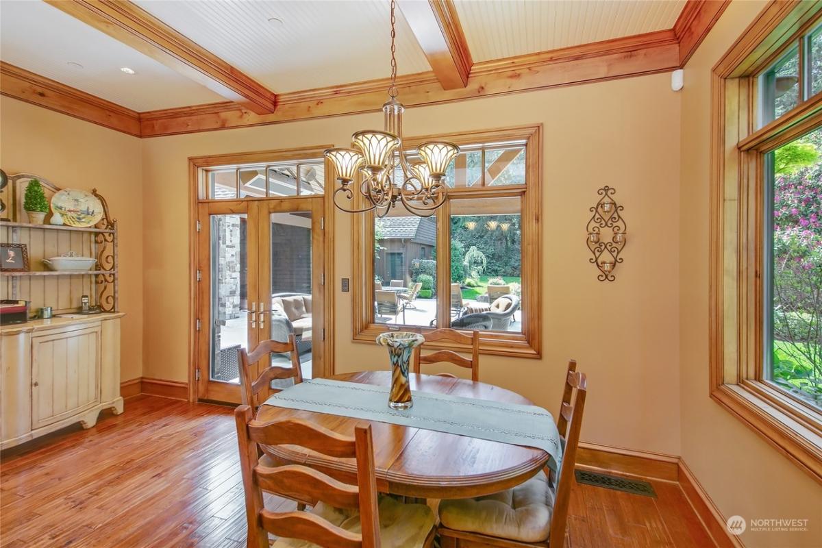 Breakfast nook with a wood table and chairs.