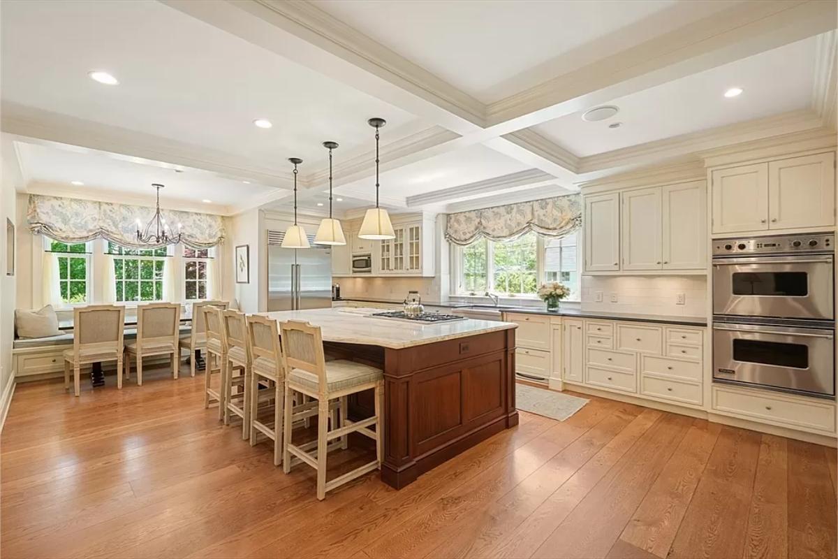 Kitchen with custom cabinetry and a counter breakfast bar.