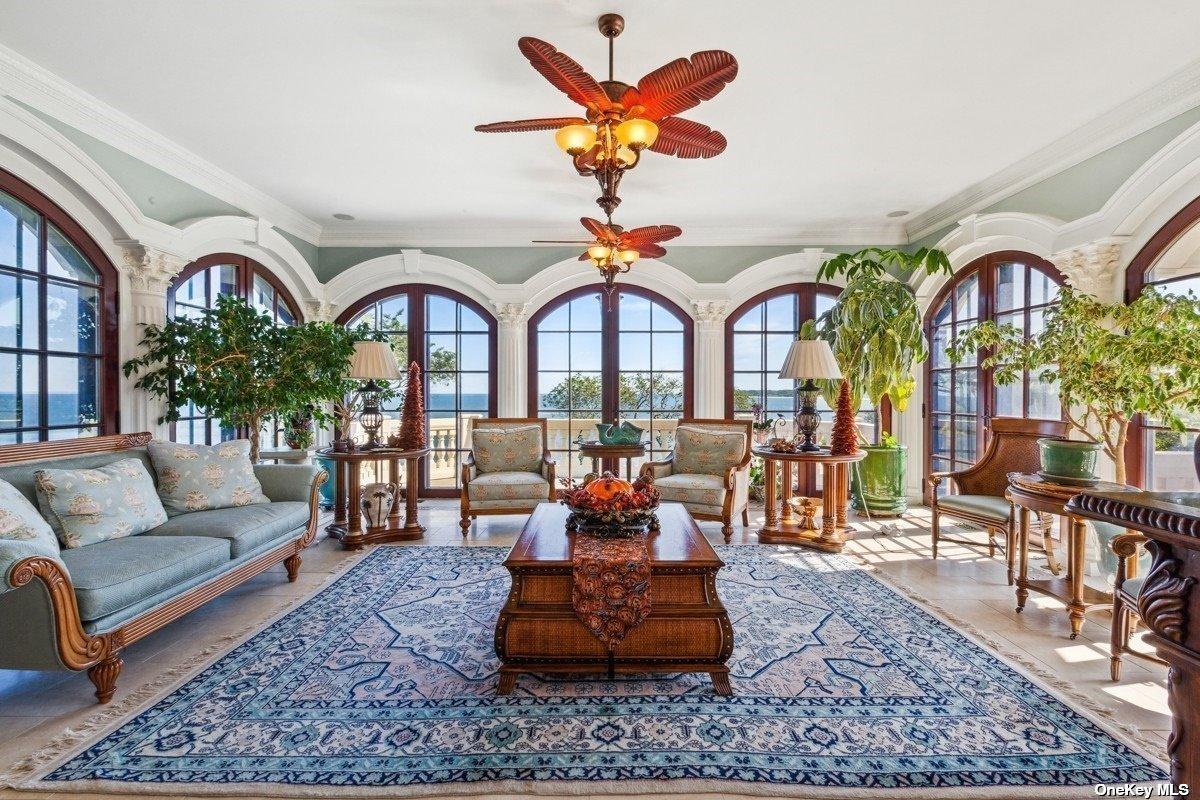 Living room with couches and glass doors.