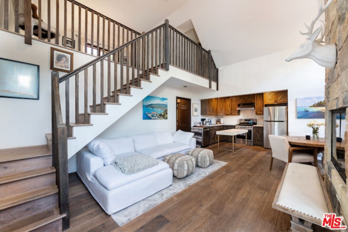 A great room seamlessly integrating living space, dining area, and kitchen.