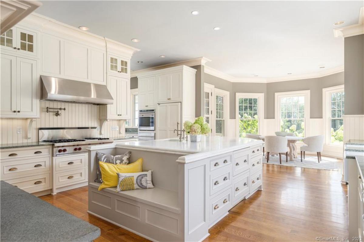 Kitchen with custom cabinetry and a center island prep area.