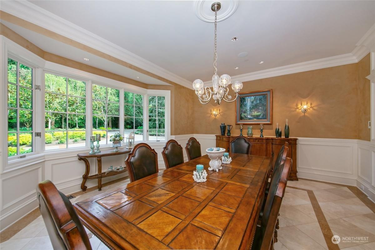 Dining room with a wood table and chairs.