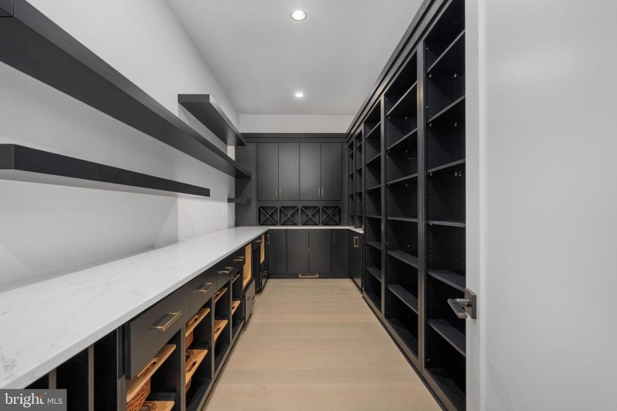 A walk-in closet with cabinets.