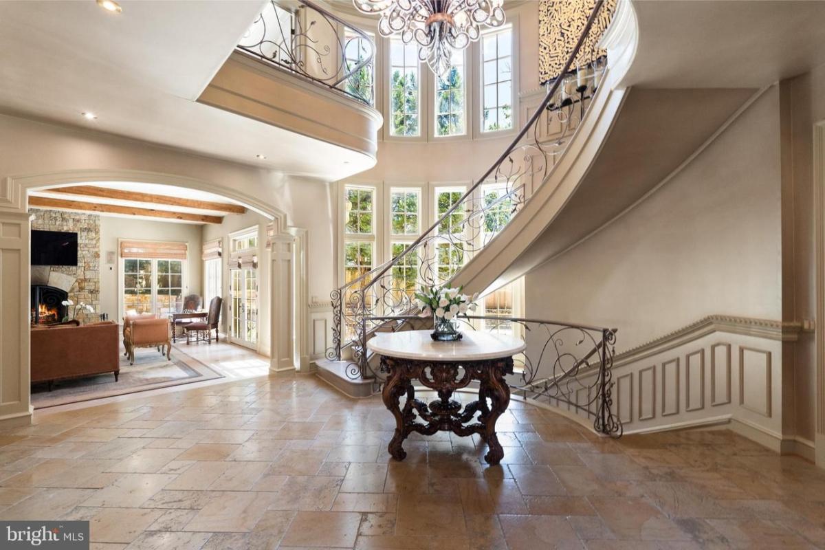 Stairs with a chandelier.