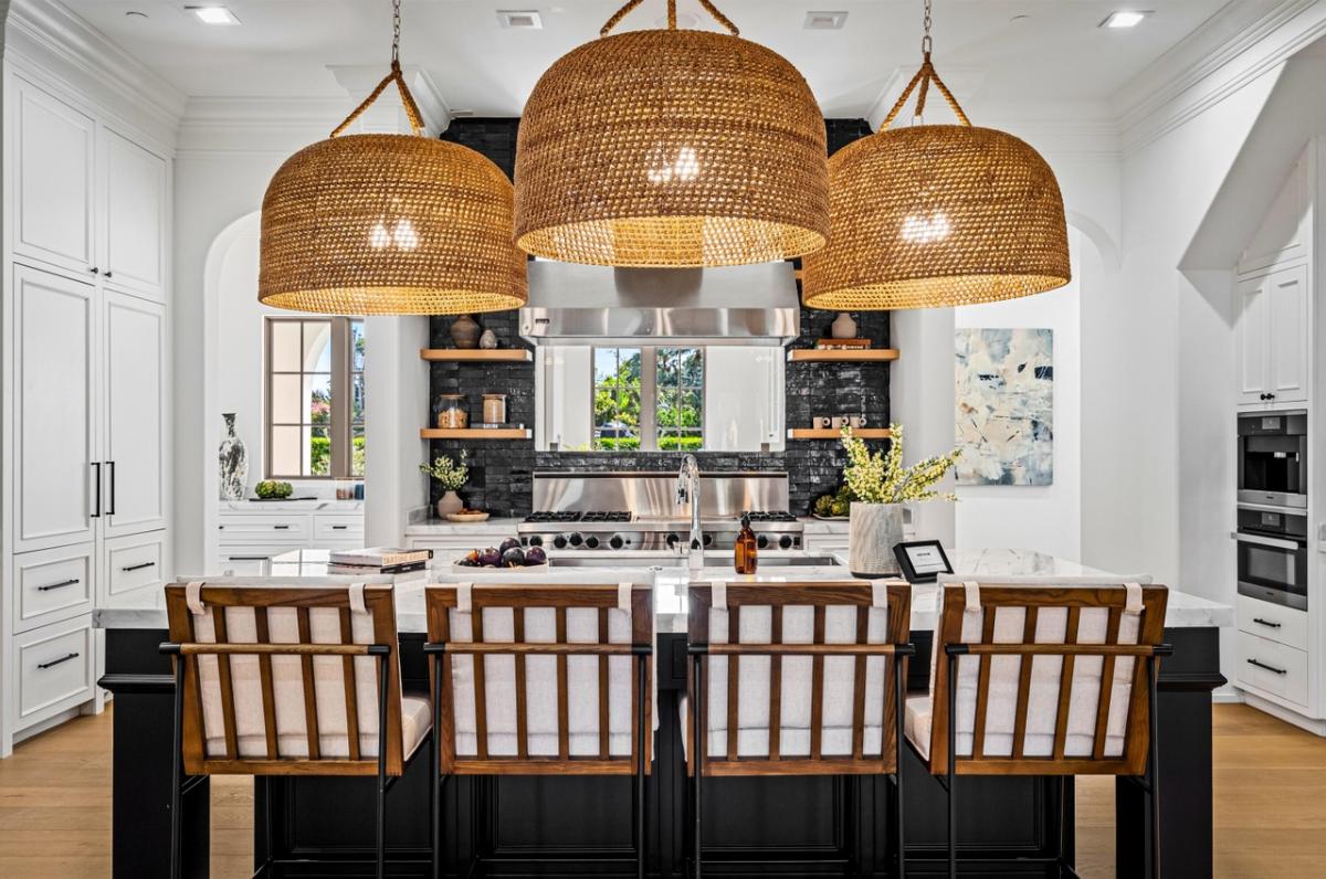 Kitchen with custom cabinetry and counter breakfast bar.