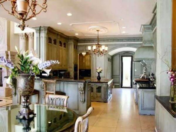 Kitchen with ample cabinets, a center island, and a peninsula bar.