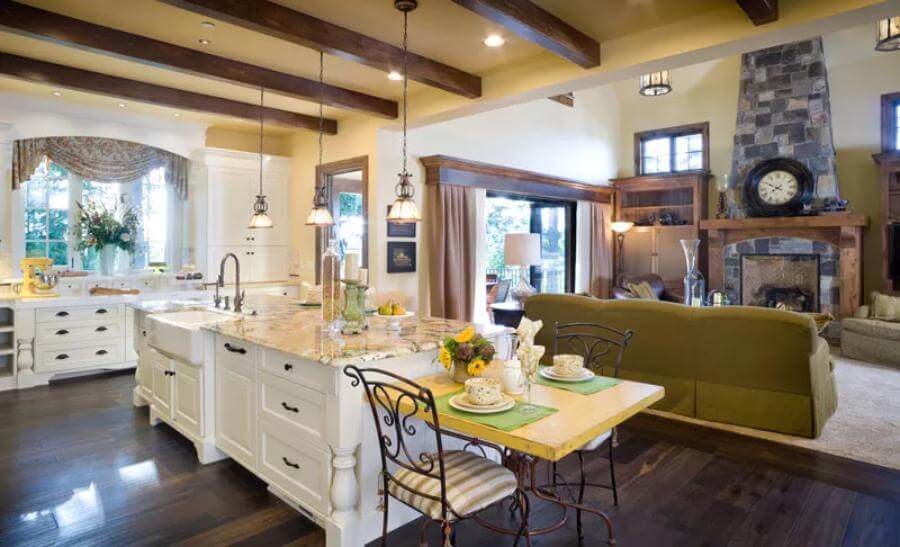 Kitchen island with a farmhouse sink overlooking the great room.