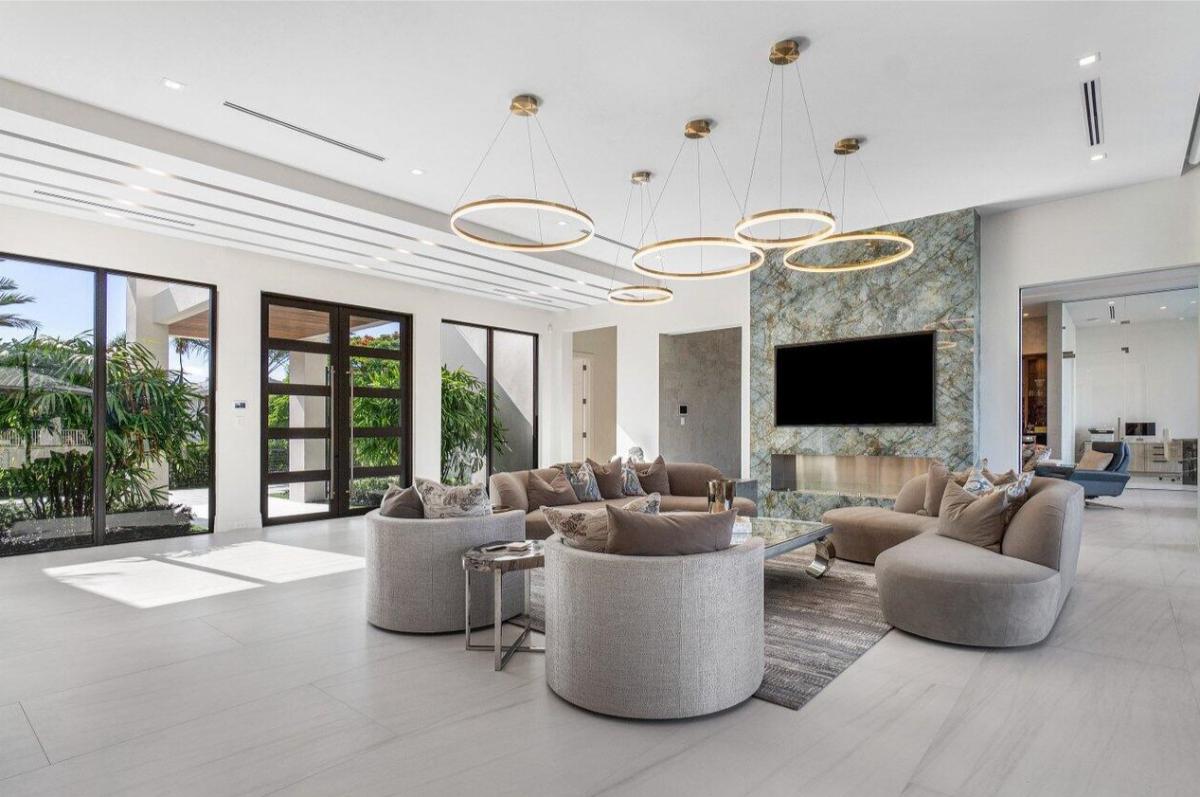 Living room with couches and a fireplace.