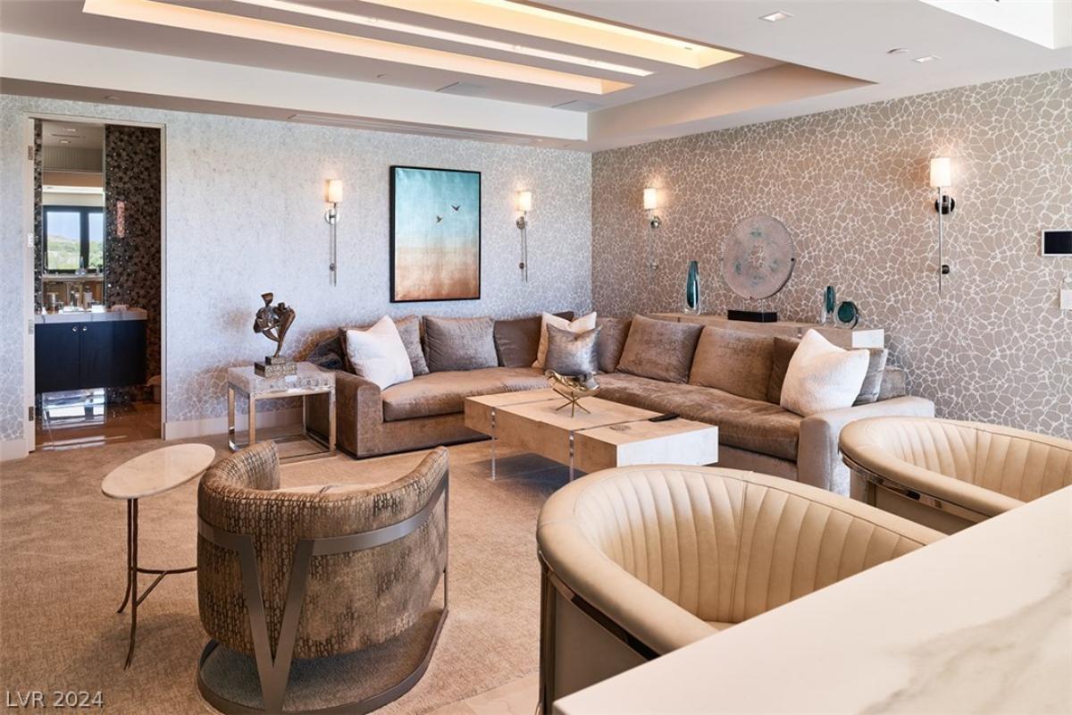 Living space with couches and custom lighting.