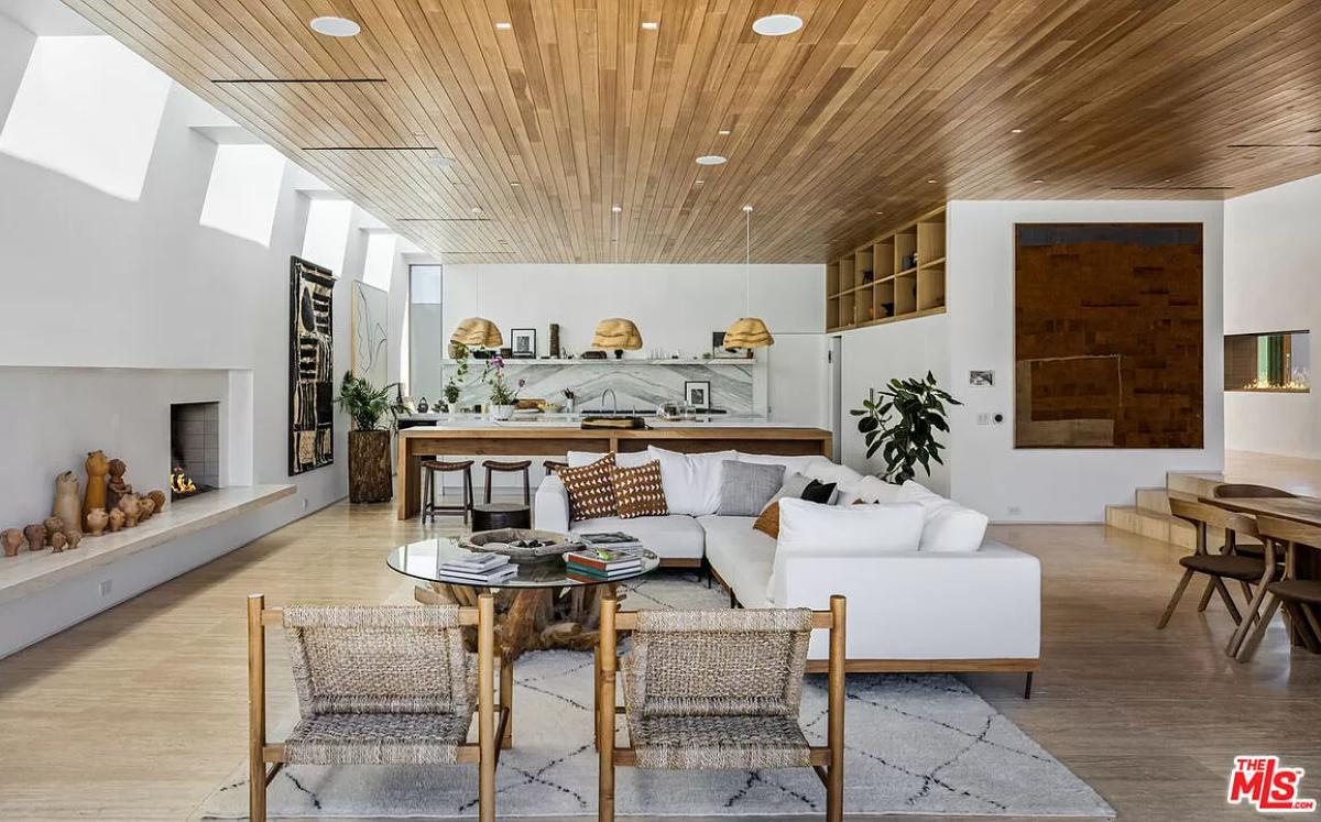 Living room with a glass table and couches.