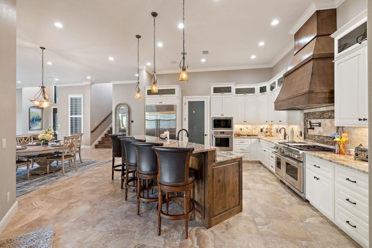 Kitchen with custom cabinetry and a counter breakfast bar.