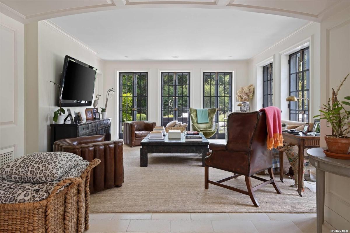 Family room with couches and a TV.