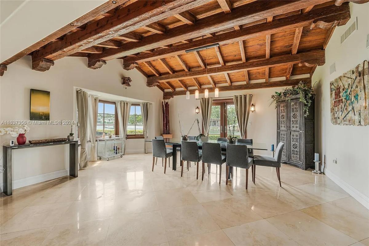 Dining room with a large table and chairs.