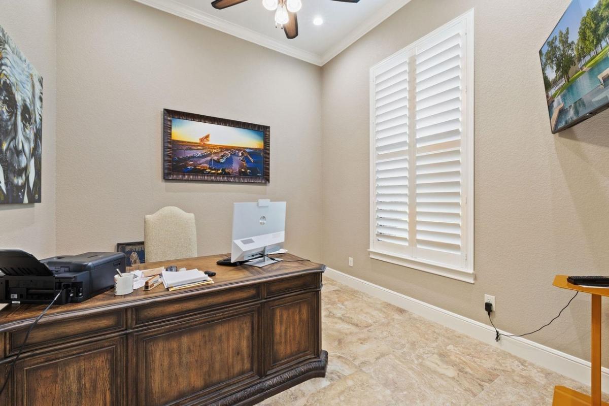 Home office with tile flooring.