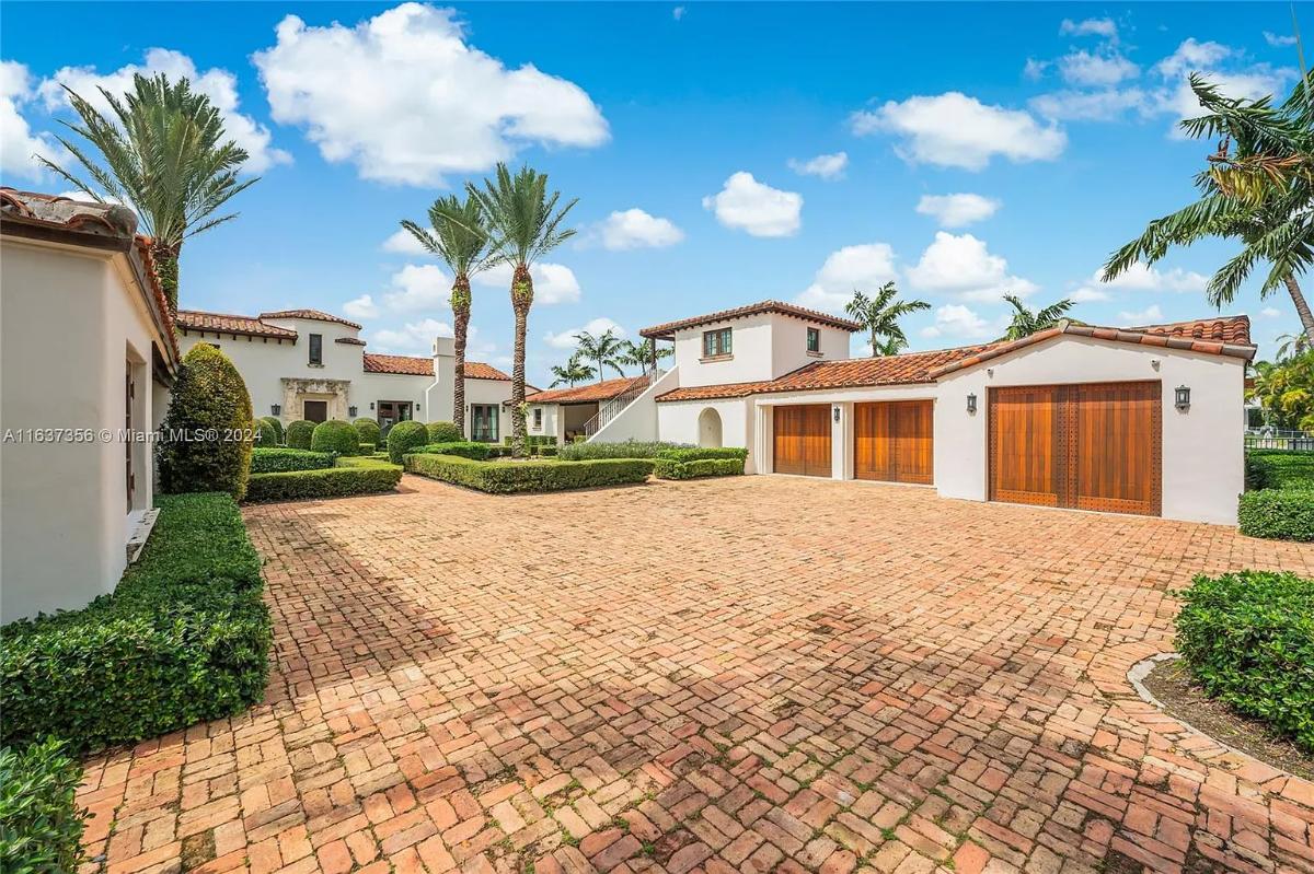 Garage with a spacious driveway.