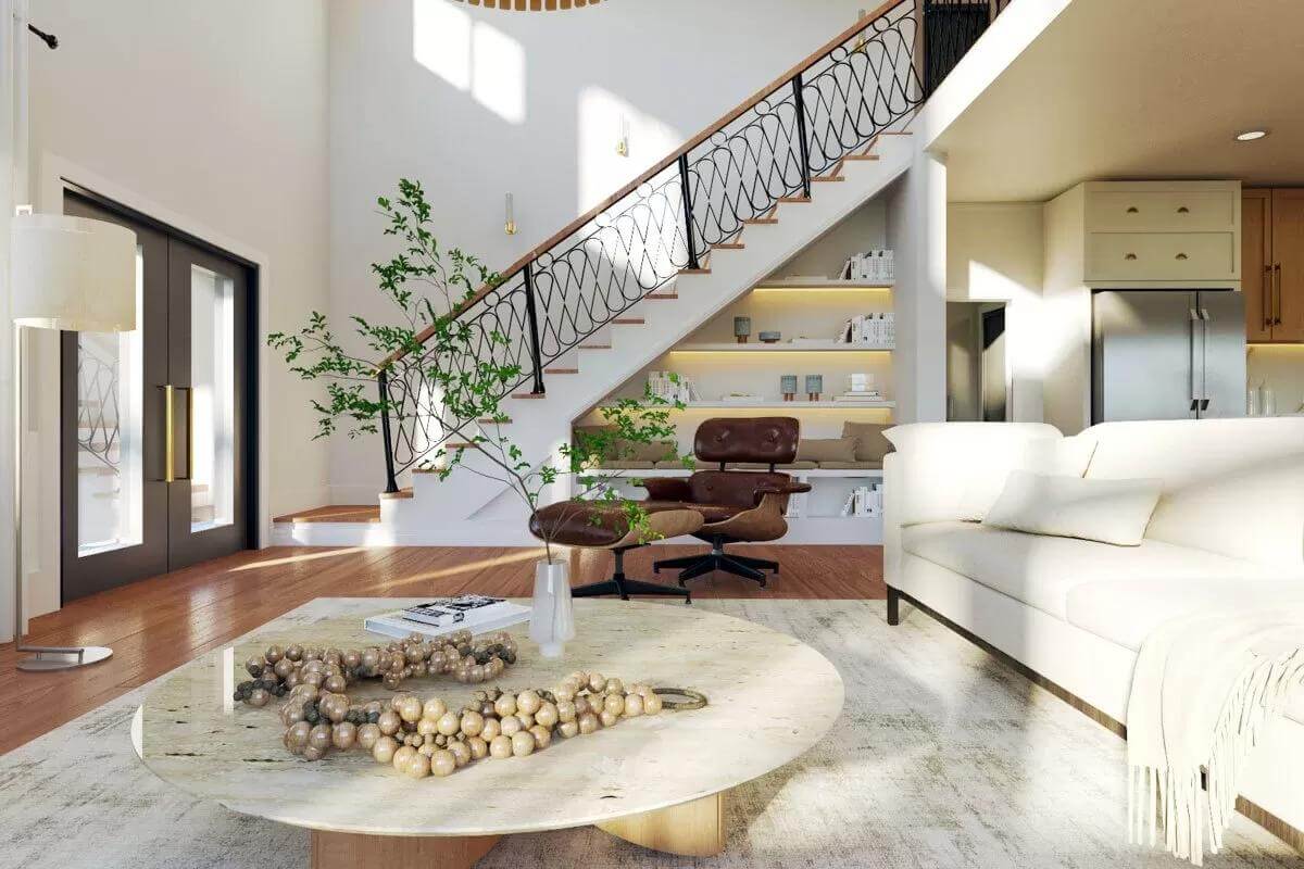 Living room with a sectional sofa and a low coffee table over the distressed area rug.