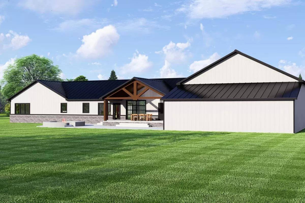 Rear view with a gabled patio and a fire pit seating.