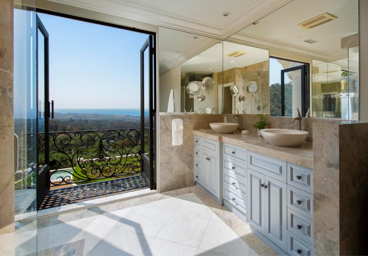 Bathroom with a custom-made vanity and a balcony.