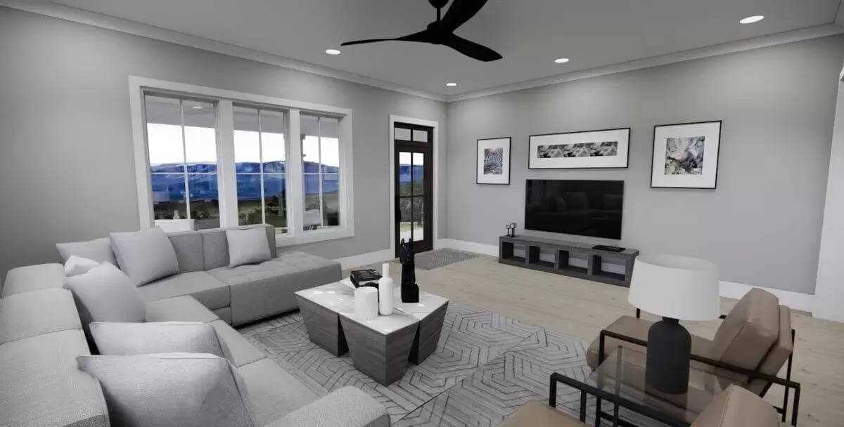 Great room with modern seats and a wall-mounted TV.