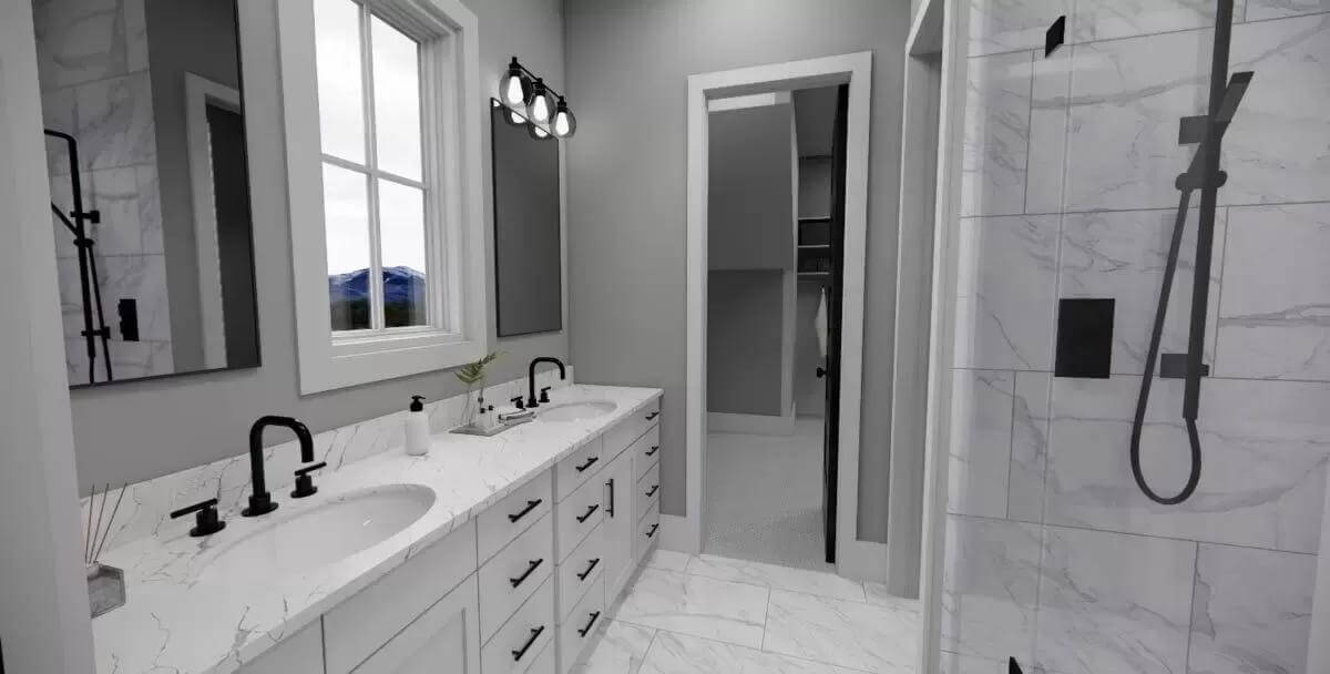 Primary bathroom with a dual sink vanity and a tiled shower.