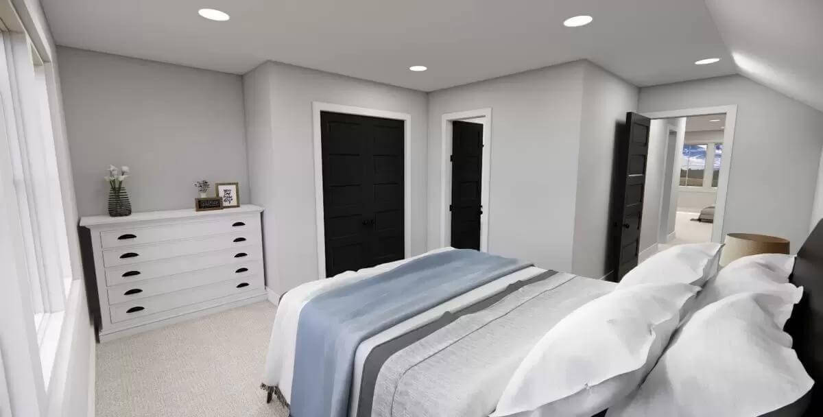 Bedroom with a white dresser and an ensuite bathroom.
