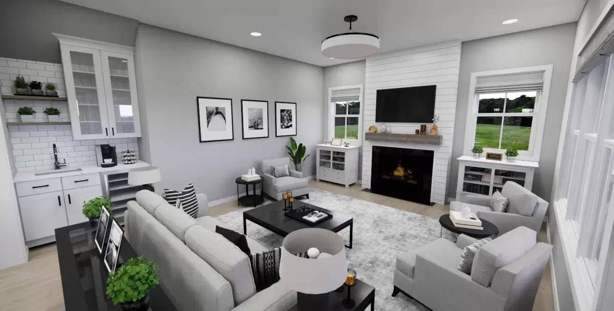 Great room with gray seats and a fireplace flanked by base cabinets.