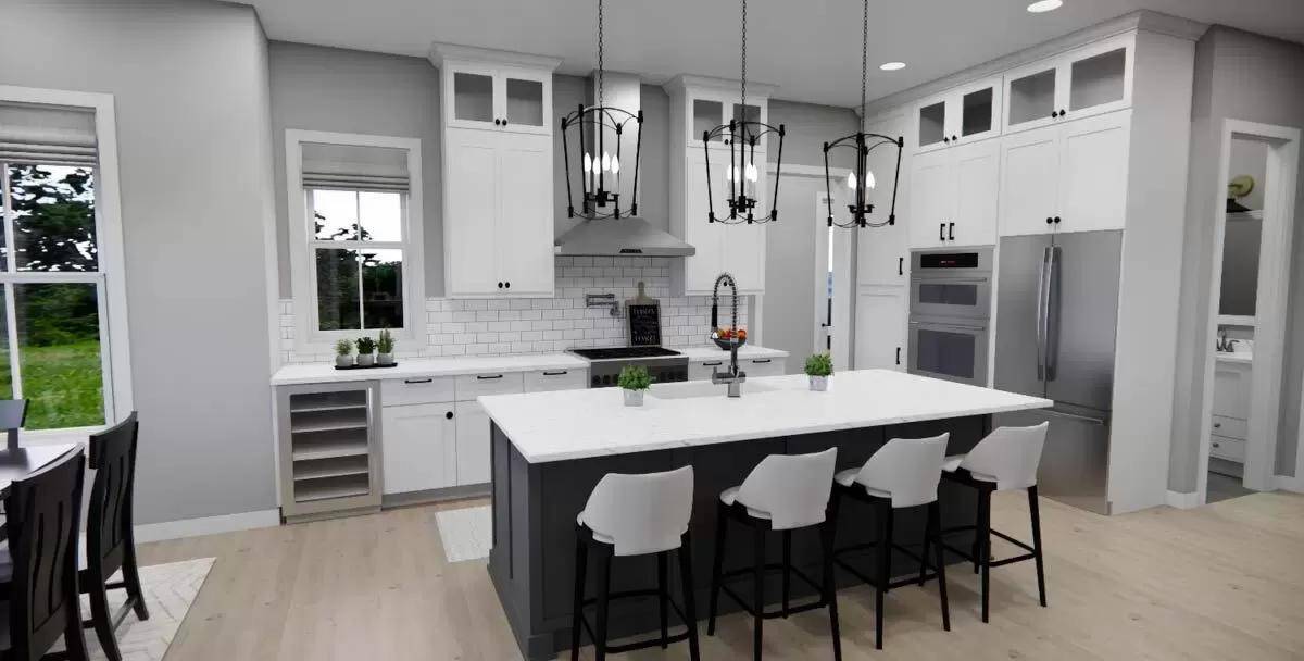 Kitchen with white cabinets and a contrasting island.