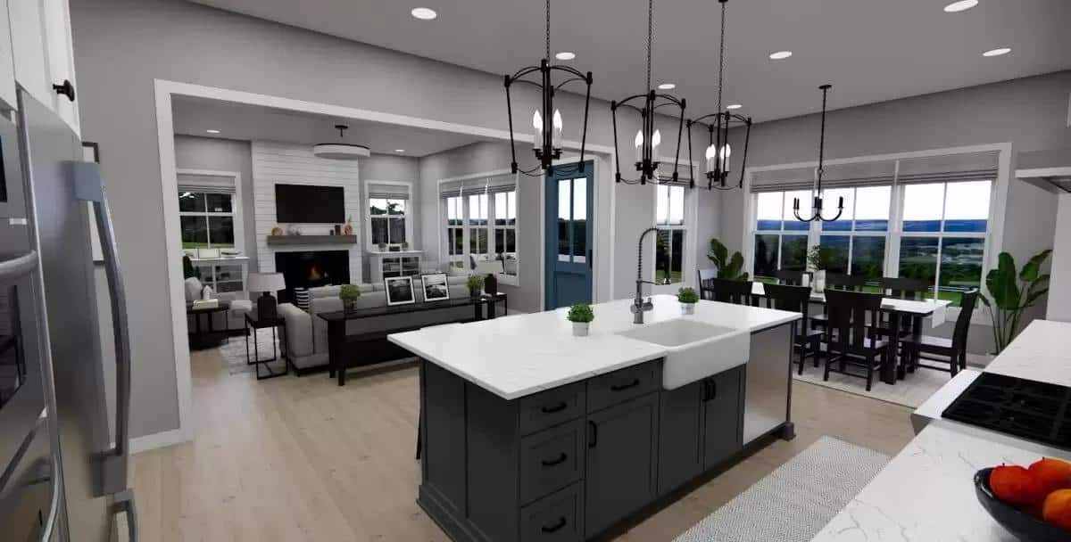 Kitchen island with a farmhouse sink overlooking the great room and dining room.