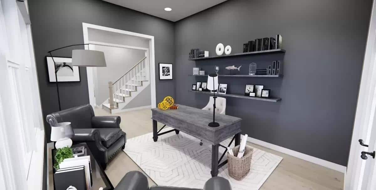 Office with leather chairs, a rustic desk, and floating shelves fixed against the black walls.