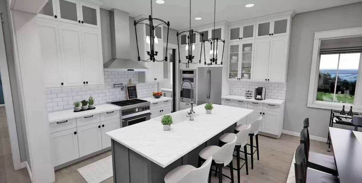 Kitchen with white cabinets, slate appliances, and a breakfast island illuminated by wrought iron pendants.