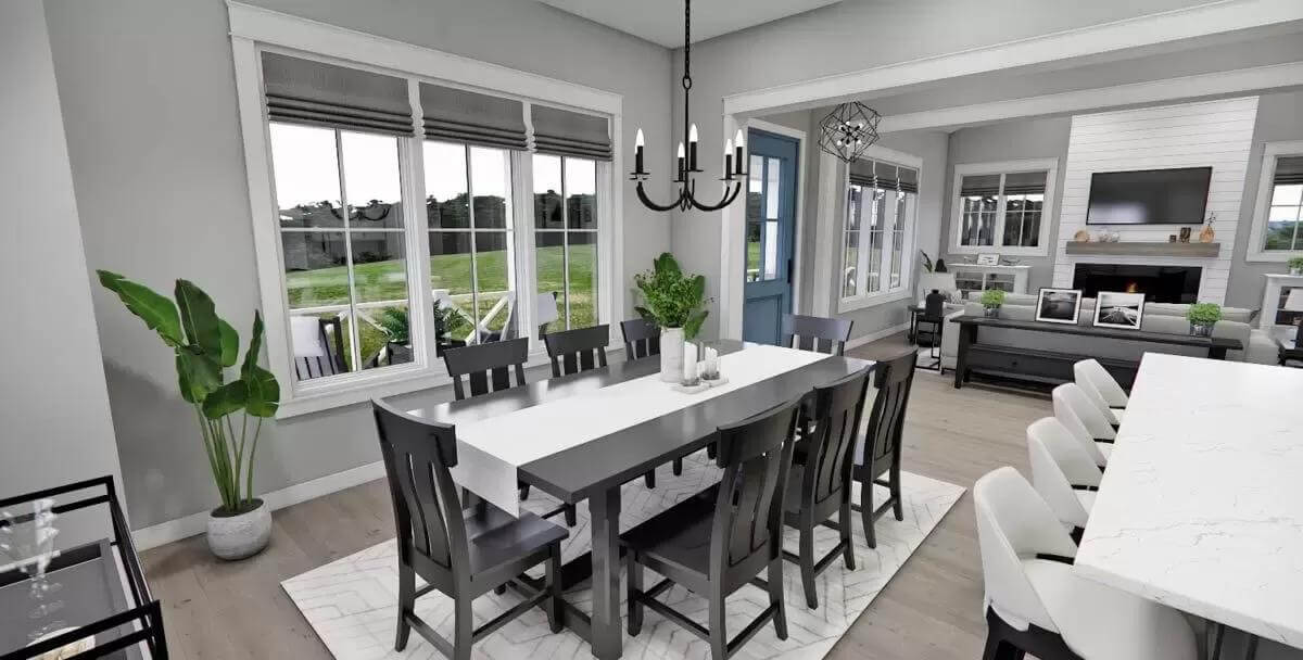 Dining room with a rectangular dining set illuminated by a wrought iron pendant.