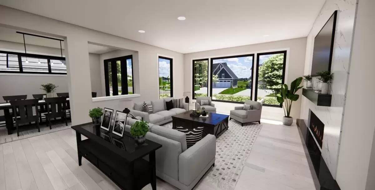Great room with gray seats, black tables, and large windows.