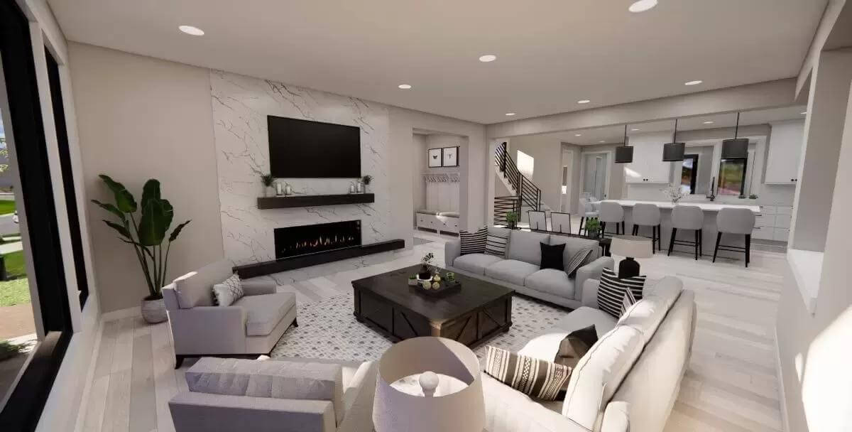 The great room includes a marble fireplace with a TV on top.